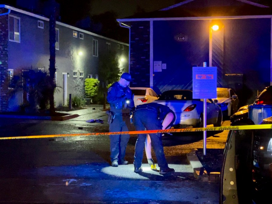 Police investigate an incident on Columbus Avenue connected to another on West Seventh Street after midnight, Saturday, May 6, 2023, in Chico, Calif. Officials say officers responding around 3:30 a.m. Saturday to reports of gunfire found six people shot at an apartment building. (Michael Weber/The Chico Enterprise-Record via AP)