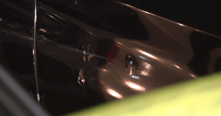 After a shooting at a nearby gas station, what is believed to be the vehicle the victim arrived in was found peppered with bullet holes on May 10, 2023. (KTLA)