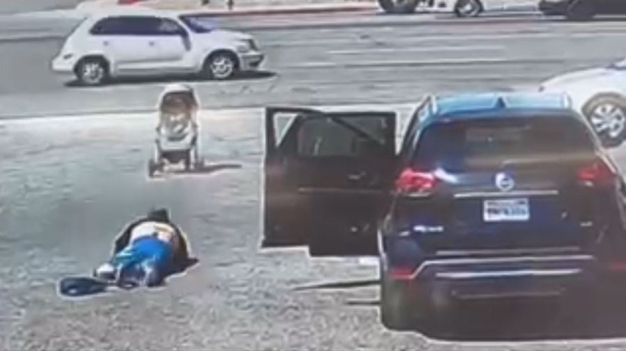 Security video captures the terrifying moment a baby stroller nearly rolls into oncoming traffic in Hesperia on May 1, 2023. (OnScene.TV)