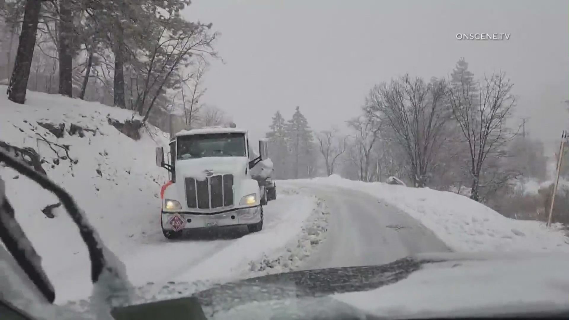 Trucks stuck in the snow after a heavy snowfall blankets Southern California mountains on May 4, 2023. (OnScene.TV)