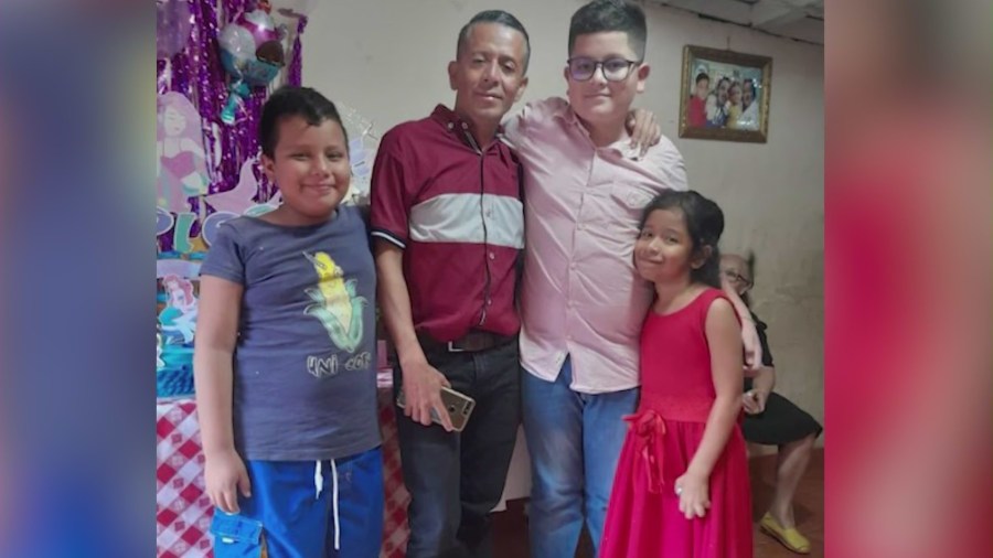 Juan Lopez with his children in a family photo.