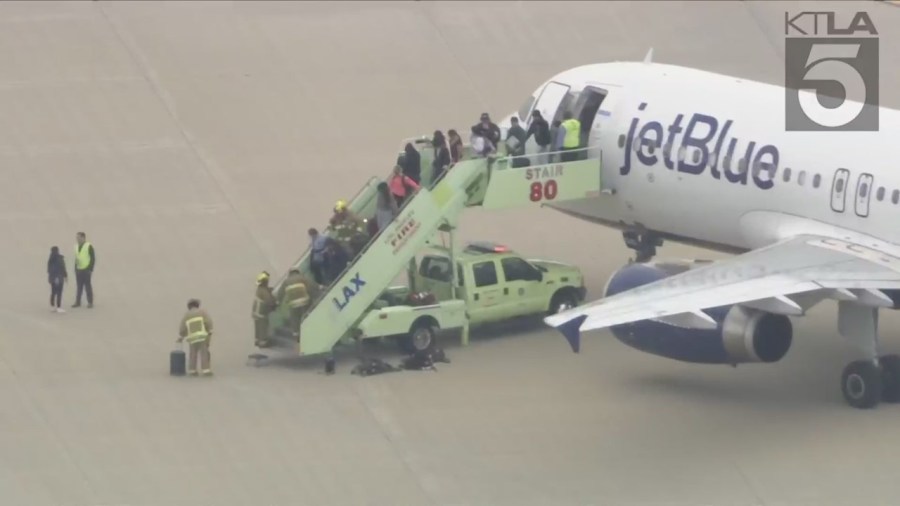 A JetBlue flight from las Vegas to Los Angeles was evacuated after reports of a suspicious package on board. (KTLA)