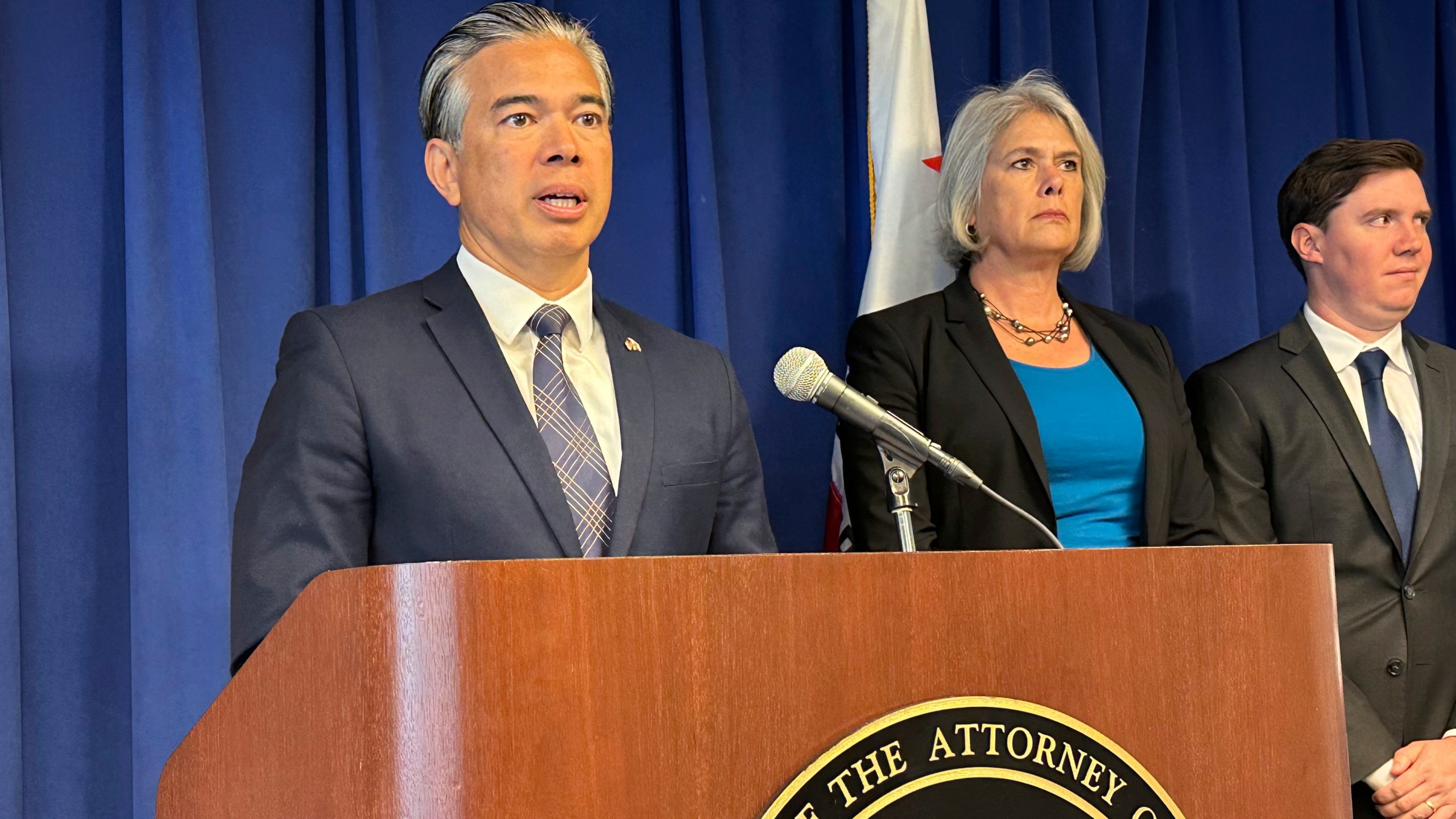 California Attorney General Rob Bonta, left, speaks during a news conference in Sacramento, California, in this undated photo.