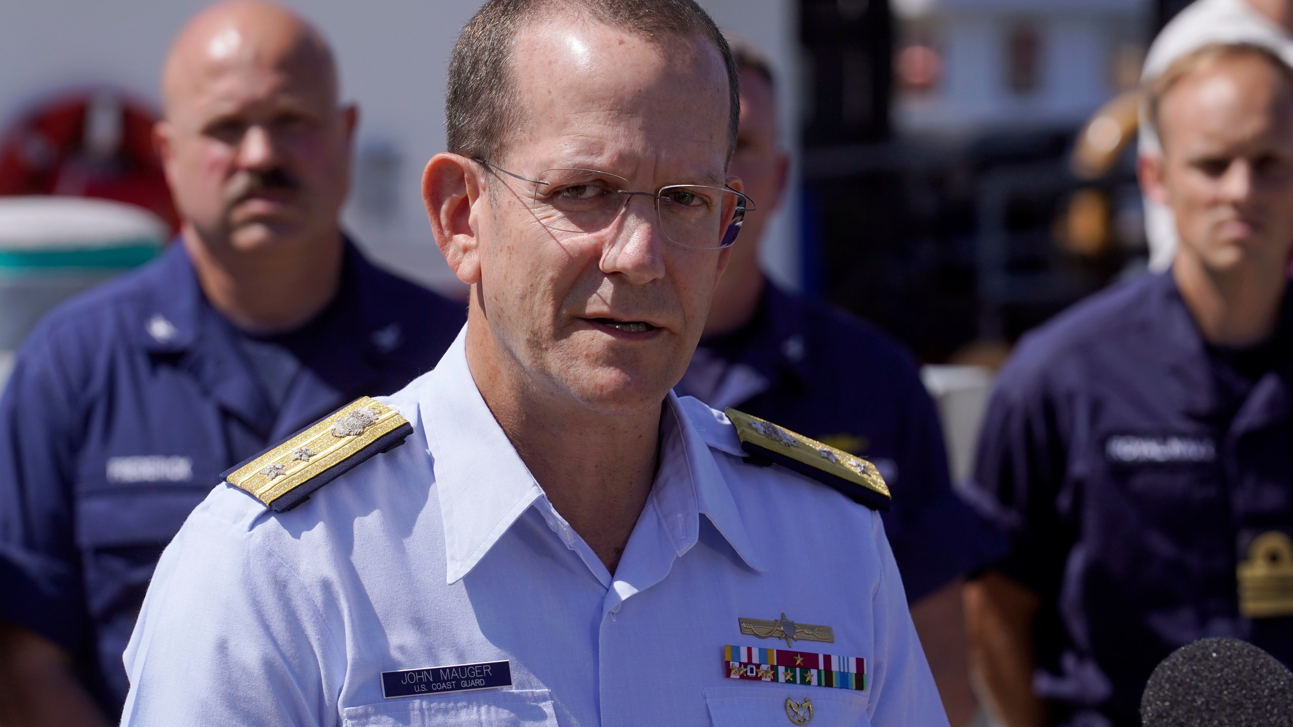 U.S. Coast Guard Rear Adm. John Mauger, commander of the First Coast Guard District, talks to the media, Thursday, June 22, 2023, at Coast Guard Base Boston, in Boston. The missing submersible Titan imploded near the wreckage of the Titanic, killing all five people on board, according to the U.S. Coast Guard. (AP Photo/Steven Senne)