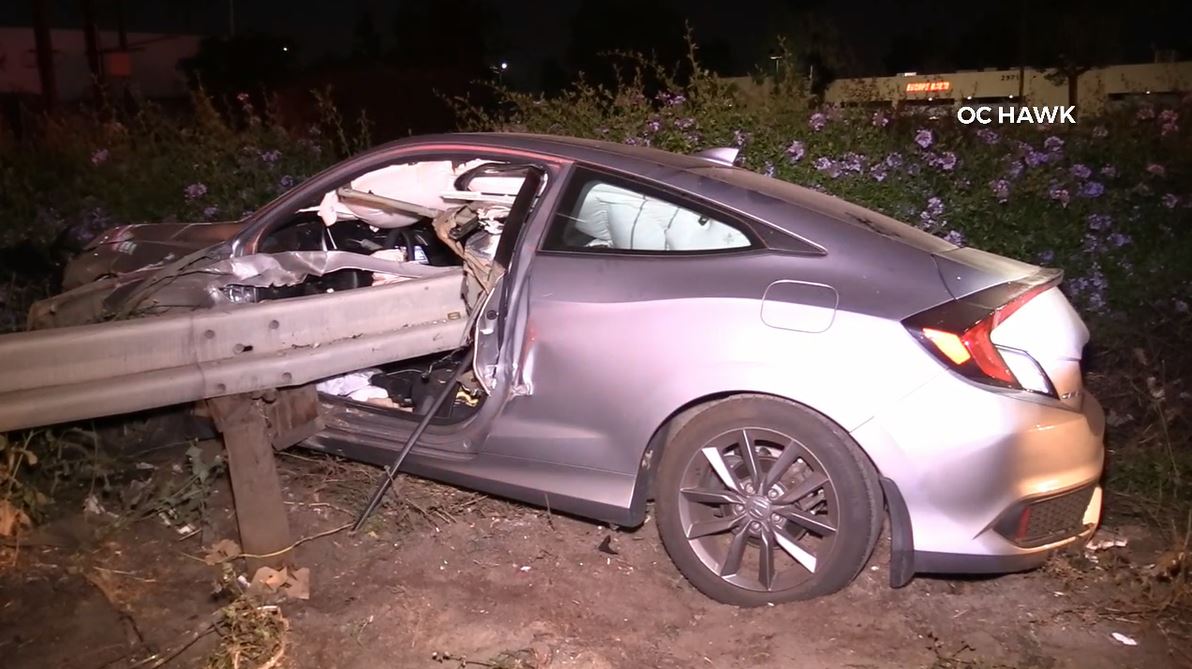 A violent crash into a freeway guardrail left a driver hospitalized in Anaheim on June 3, 2023. (OC Hawk)