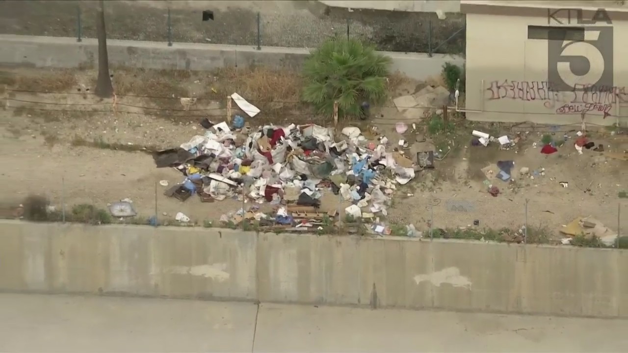 A homeless encampment near the Chatsworth Metrolink station, shown on June 1, 2023, has riled residents. (KTLA)