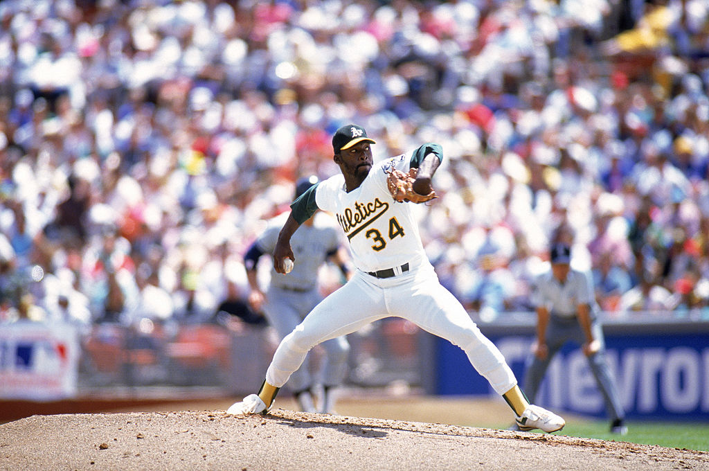 Pitcher Dave Stewart #34 of the Oakland Athletics delivers a pitch during a game against the New York Yankees in the 1990 season at Oakland Alameda County Stadium in Oakland, California. (Getty Images)