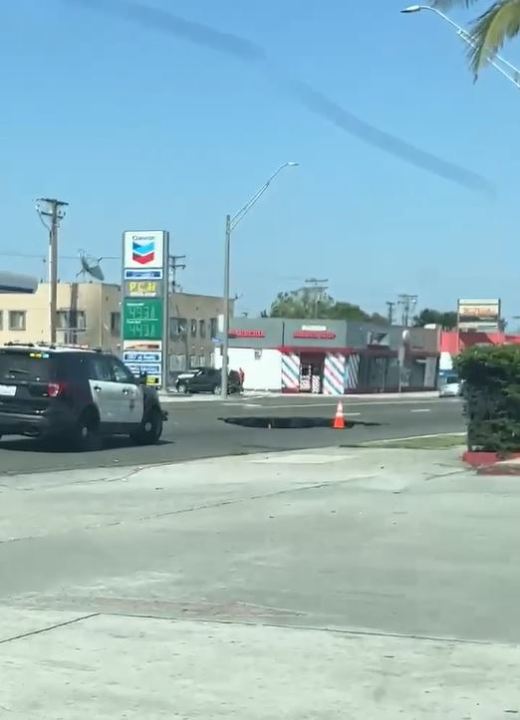 A sinkhole opened up in Long Beach along Pacific Coast Highway on June 3, 2023. (Citizen)