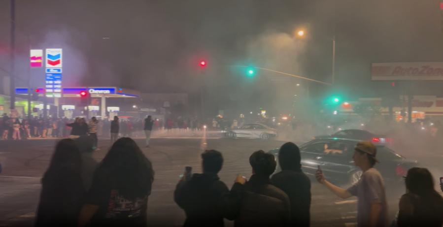 Video showed three cars and spectators involved in a street takeover on June 12, 2023.