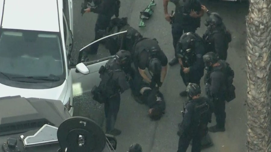 A driver is taken into custody following a standoff in Studio City on June 20, 2023. (KTLA)