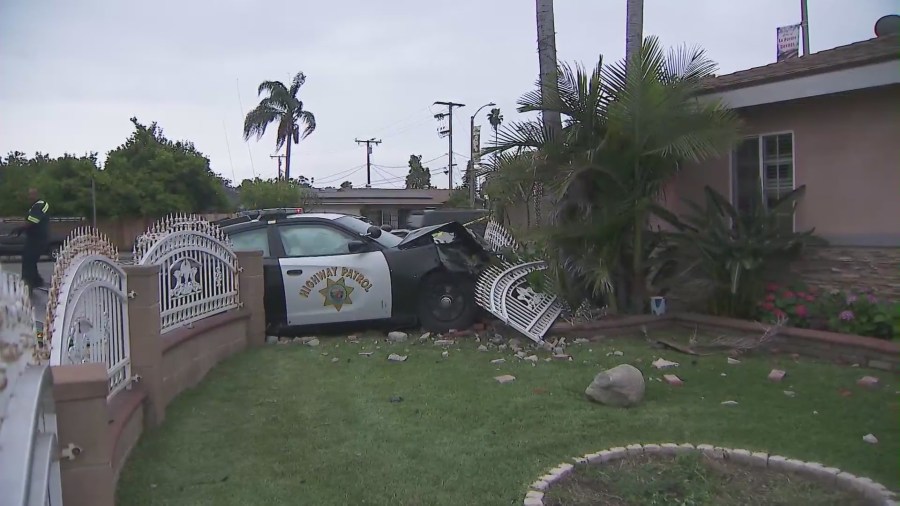 Motorcycle pursuit ends with CHP patrol cars crashing into a La Puente home on June 10, 2023. (KTLA)