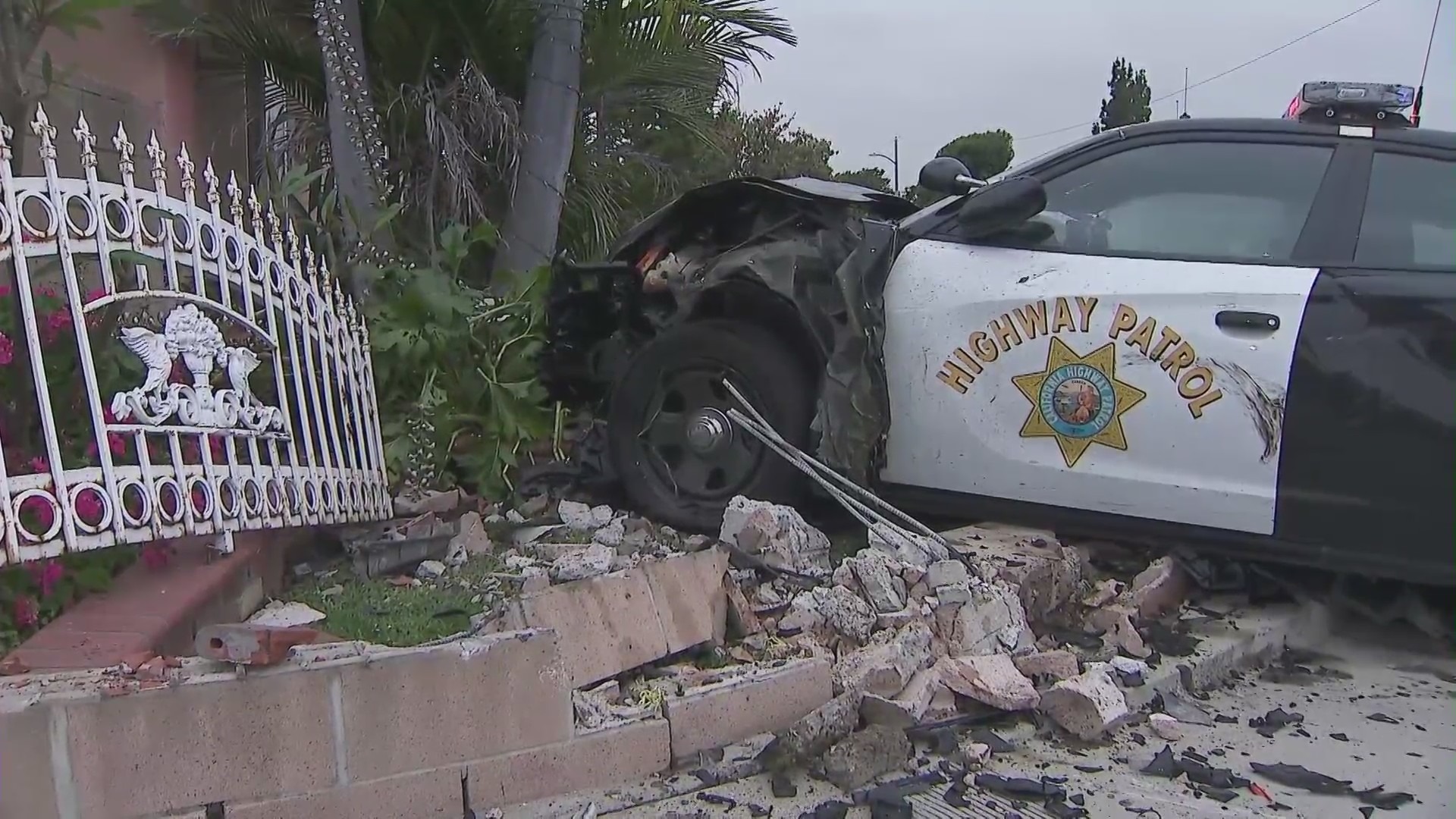 Motorcycle pursuit ends with CHP patrol cars crashing into a La Puente home on June 10, 2023. (KTLA)