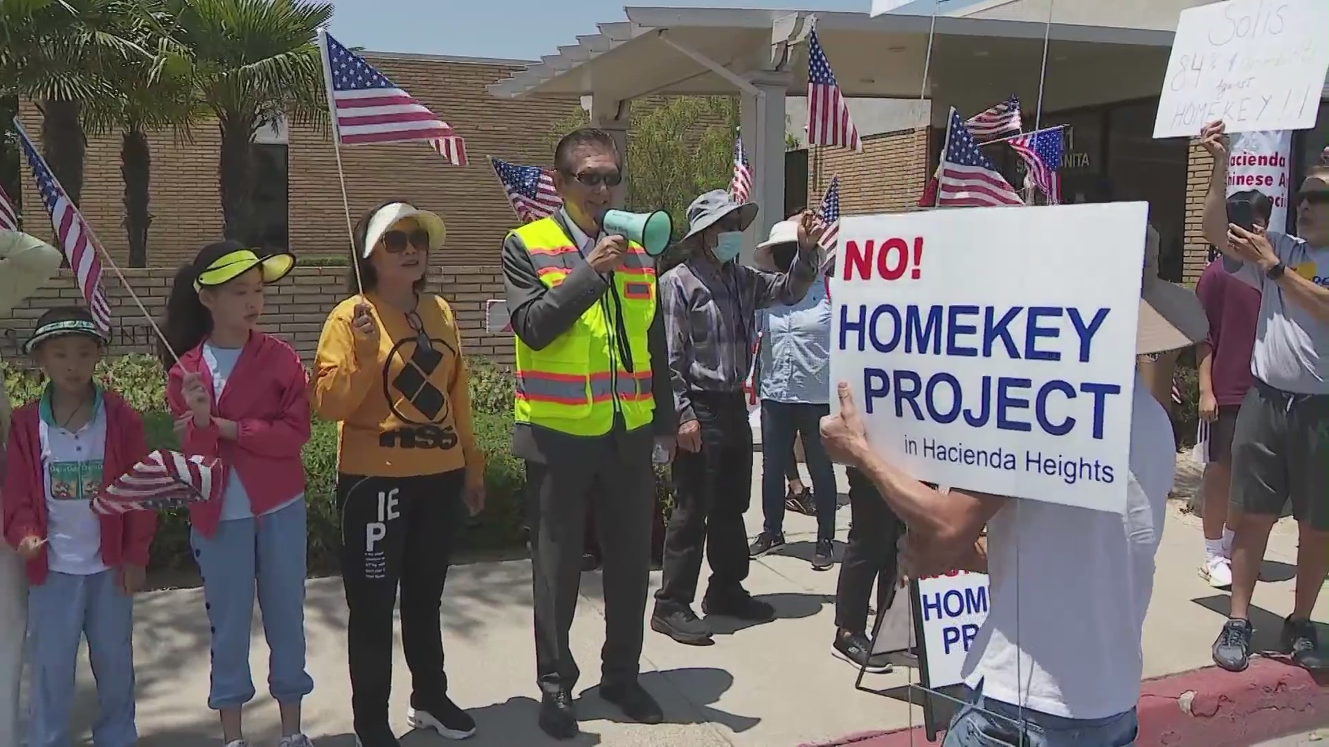 Protestors opposed to a new Project Homekey site transforming a Motel 6 into housing for homeless individuals in Hacienda Heights on June 28, 2023.