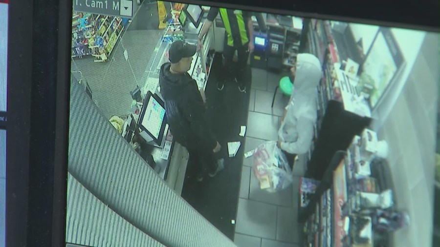 Surveillance footage captured a 7-Eleven store robbed at gunpoint by two armed suspects in East Hollywood on June 24, 2023. (7-Eleven)