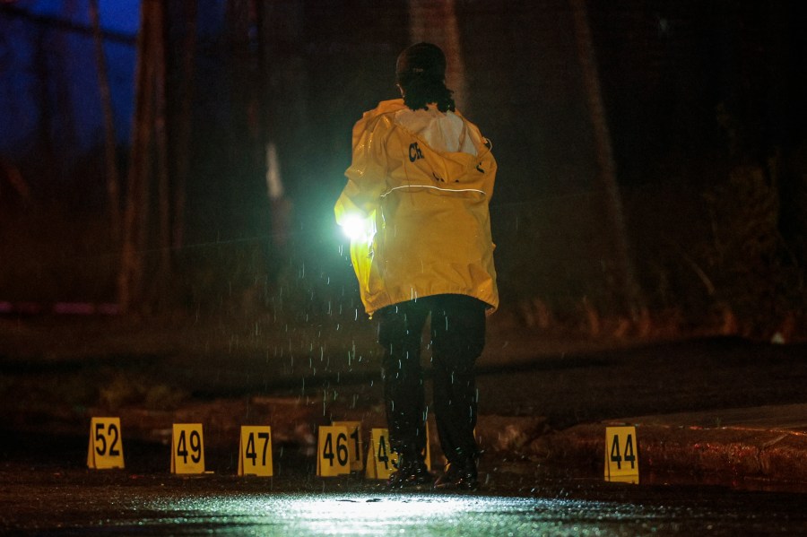 Police on the scene of a shooting Monday, July 3, 2023 in Philadelphia. Police say a gunman in a bulletproof vest has opened fire on the streets of Philadelphia, killing several people and wounding two boys before he surrendered to responding officers. (Steven M. Falk/The Philadelphia Inquirer via AP)