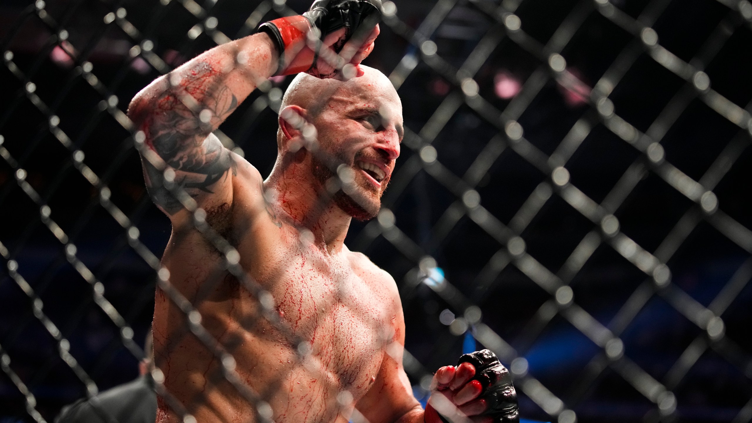 Alexander Volkanovski reacts after winning a featherweight title bout against Max Holloway during the UFC 276 mixed martial arts event, July 2, 2022, in Las Vegas. (AP Photo/John Locher, File)