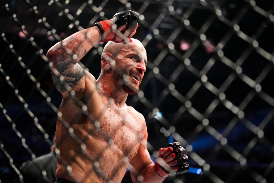 Alexander Volkanovski reacts after winning a featherweight title bout against Max Holloway during the UFC 276 mixed martial arts event, July 2, 2022, in Las Vegas. (AP Photo/John Locher, File)