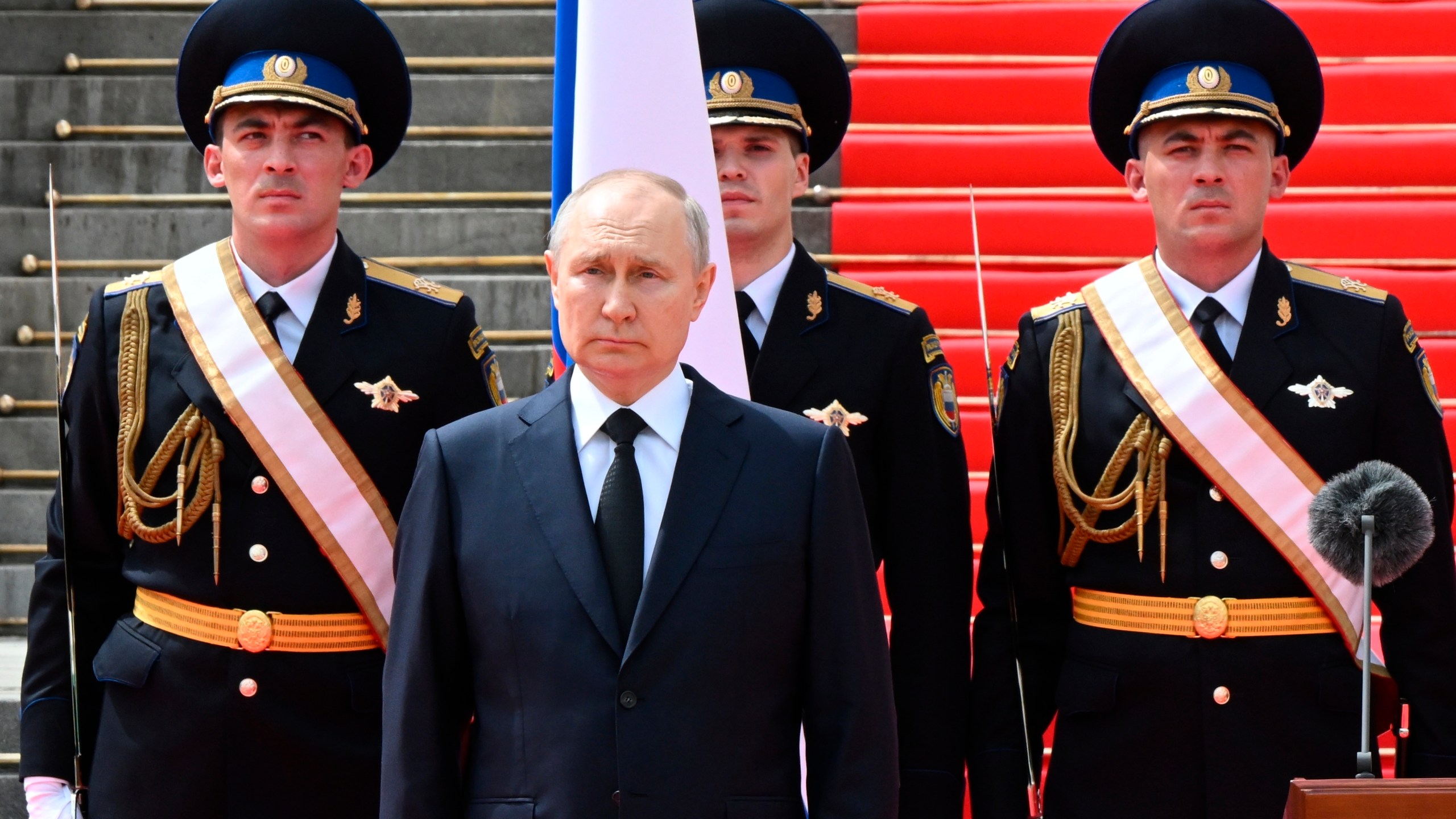 FILE - Russian President Vladimir Putin listens to the national anthem prior to delivering a speech to the units of the Russian Defense Ministry, the Russian National Guard (Rosgvardiya), the Russian Interior Ministry, the Russian Federal Security Service and the Russian Federal Guard Service, who ensured order and legality during the mutiny, at the Kremlin in Moscow, Russia, Tuesday, June 27, 2023. Russia’s rebellious mercenary chief Yevgeny Prigozhin walked free from prosecution for his June 24 armed mutiny, and it’s still unclear if anyone will face any charges in the brief uprising against the military or for the deaths of the soldiers killed in it. (Sergei Guneyev, Sputnik, Kremlin Pool Photo via AP, File)