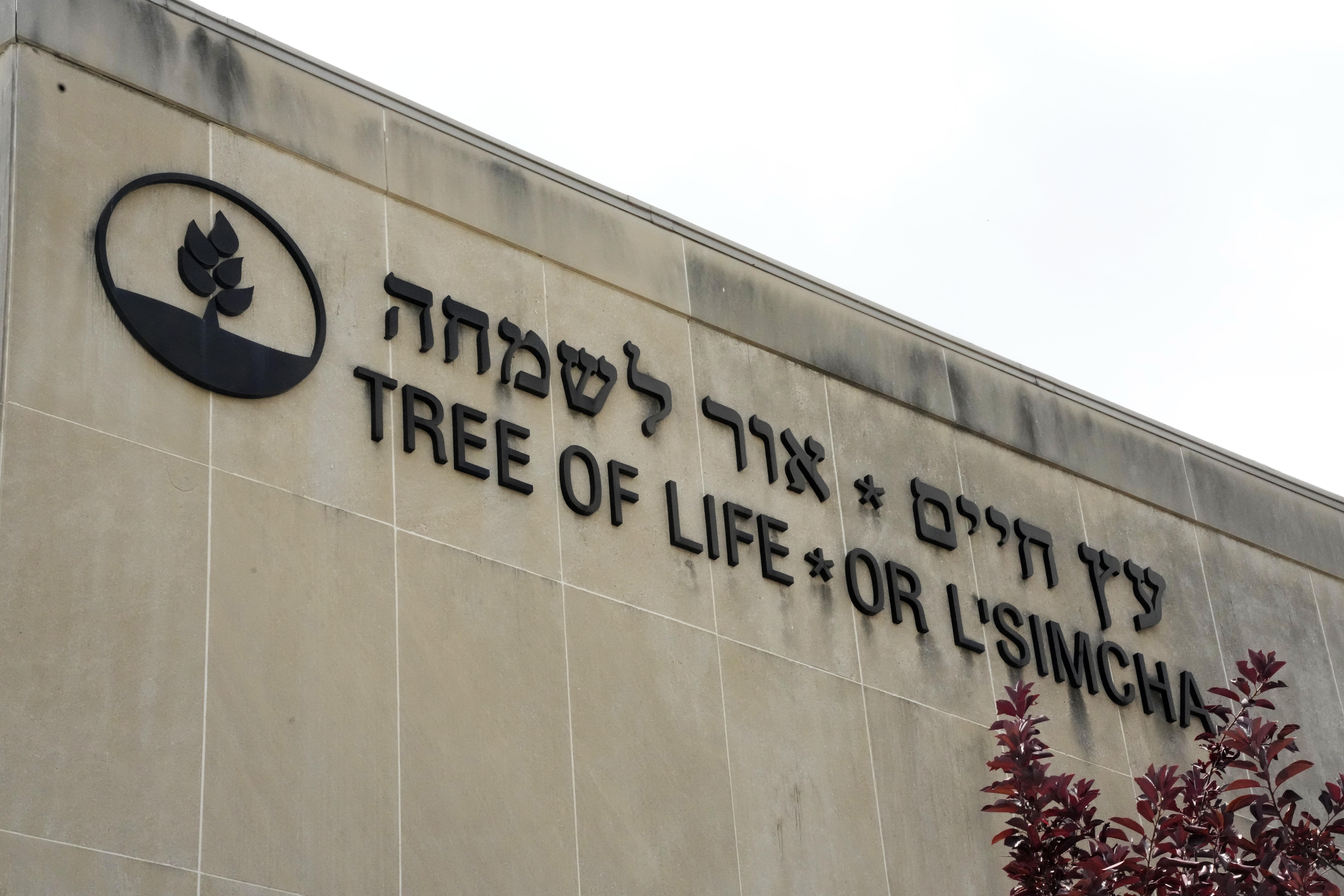 Signage marks the exterior of the dormant landmark Tree of Life synagogue in Pittsburgh's Squirrel Hill neighborhood on Thursday, July 13, 2023, the day a federal jury announced they had found Robert Bowers, who in 2018 killed 11 people at the synagogue, eligible for the death penalty. (AP Photo/Gene J. Puskar)