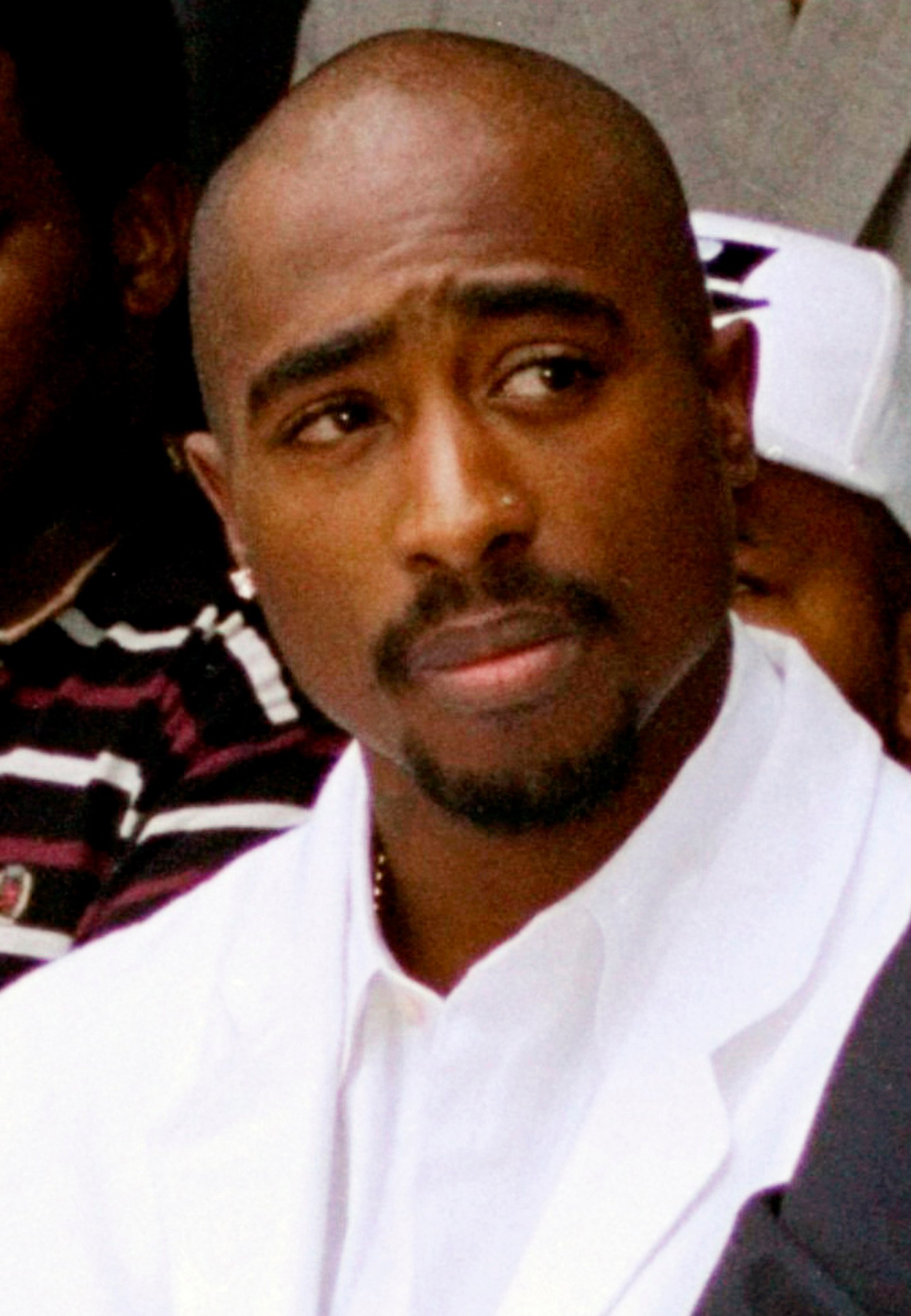 FILE - Rapper Tupac Shakur attends a voter registration event in South Central Los Angeles, Aug. 15, 1996. Authorities in Nevada confirmed Tuesday, July 18, 2023, that they served a search warrant this week in connection with the long-unsolved killing of the late rapper Shakur. (AP Photo/Frank Wiese, File)