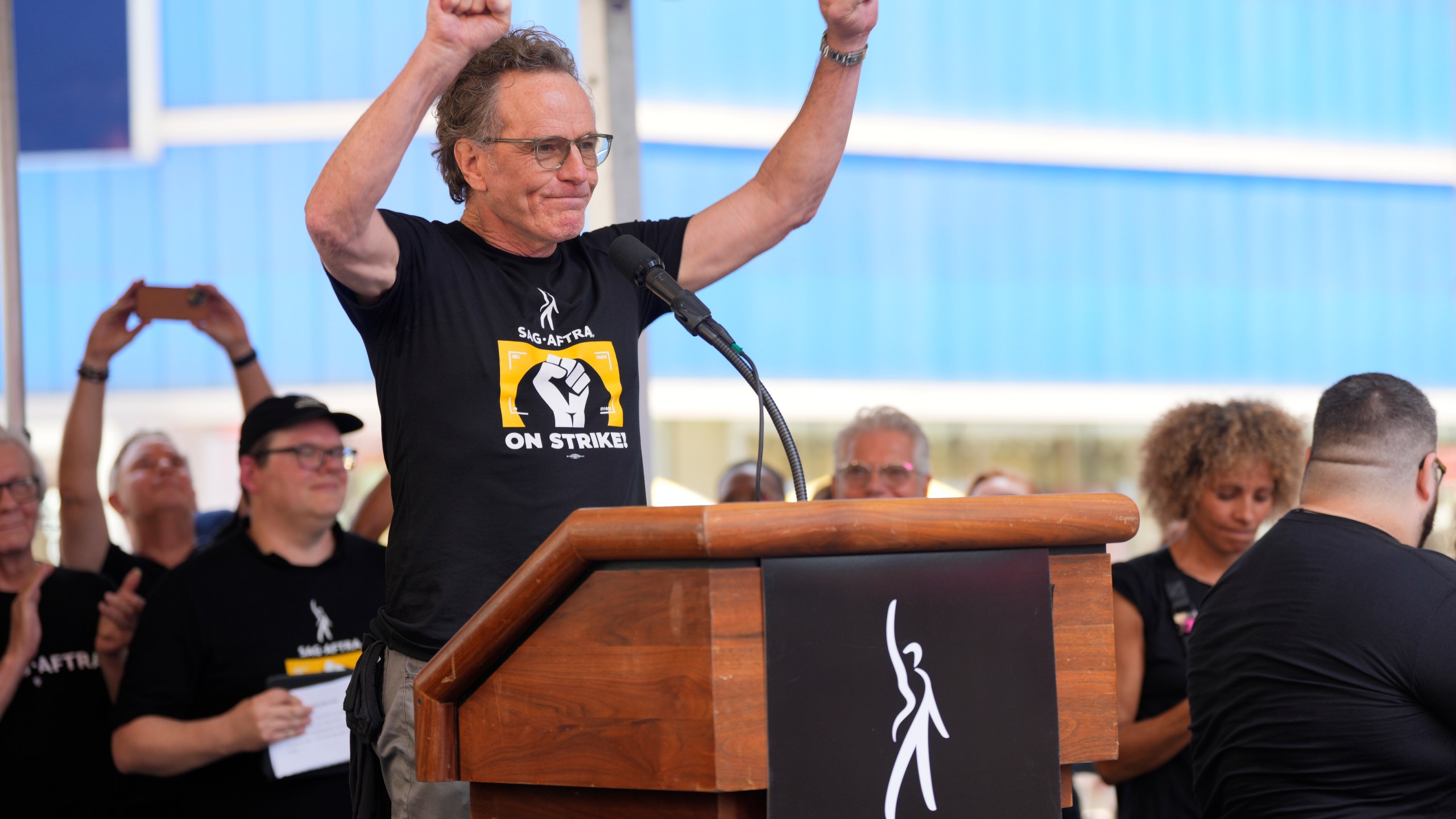 Actor Bryan Cranston speaks during the SAG-AFTRA "Rock the City for a Fair Contract" rally in Times Square on Tuesday, July 25, 2023, in New York. Charles Sykes/Invision/AP)