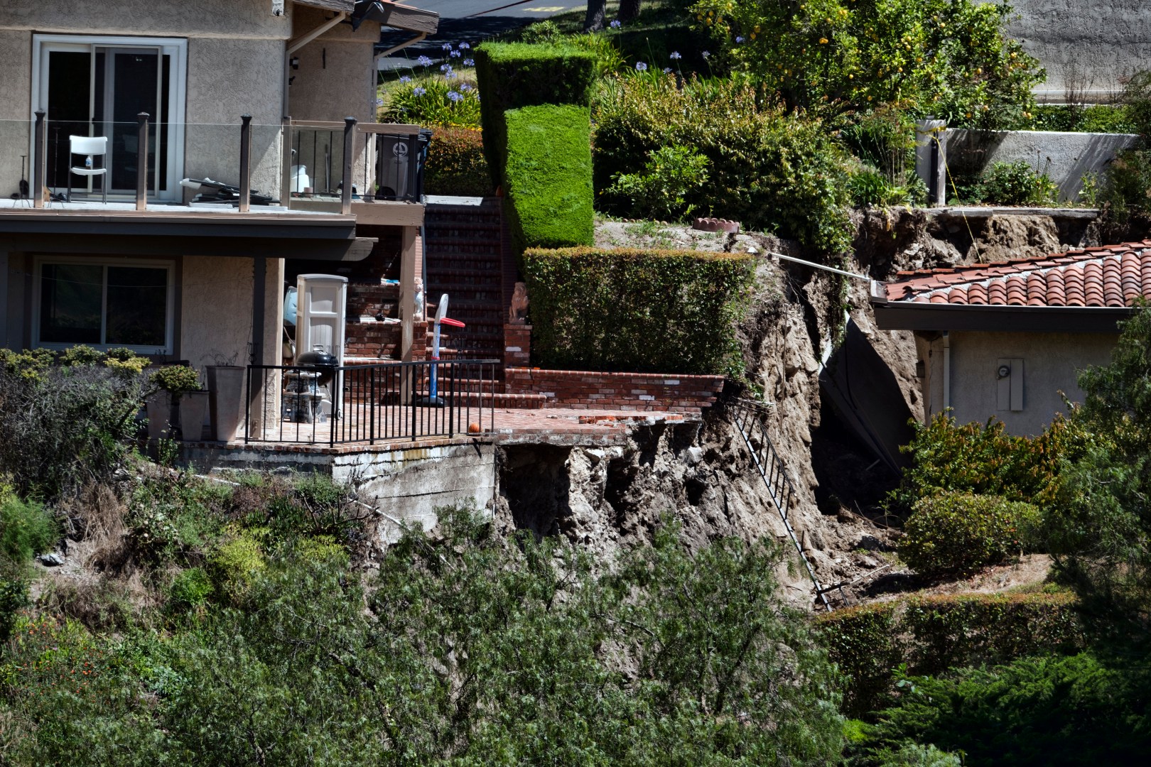 A partially destroyed patio caused by earth movement is seen in Southern California's Palos Verdes Peninsula's Rolling Hills Estates on July 10, 2023. (Richard Vogel/Associated Press)