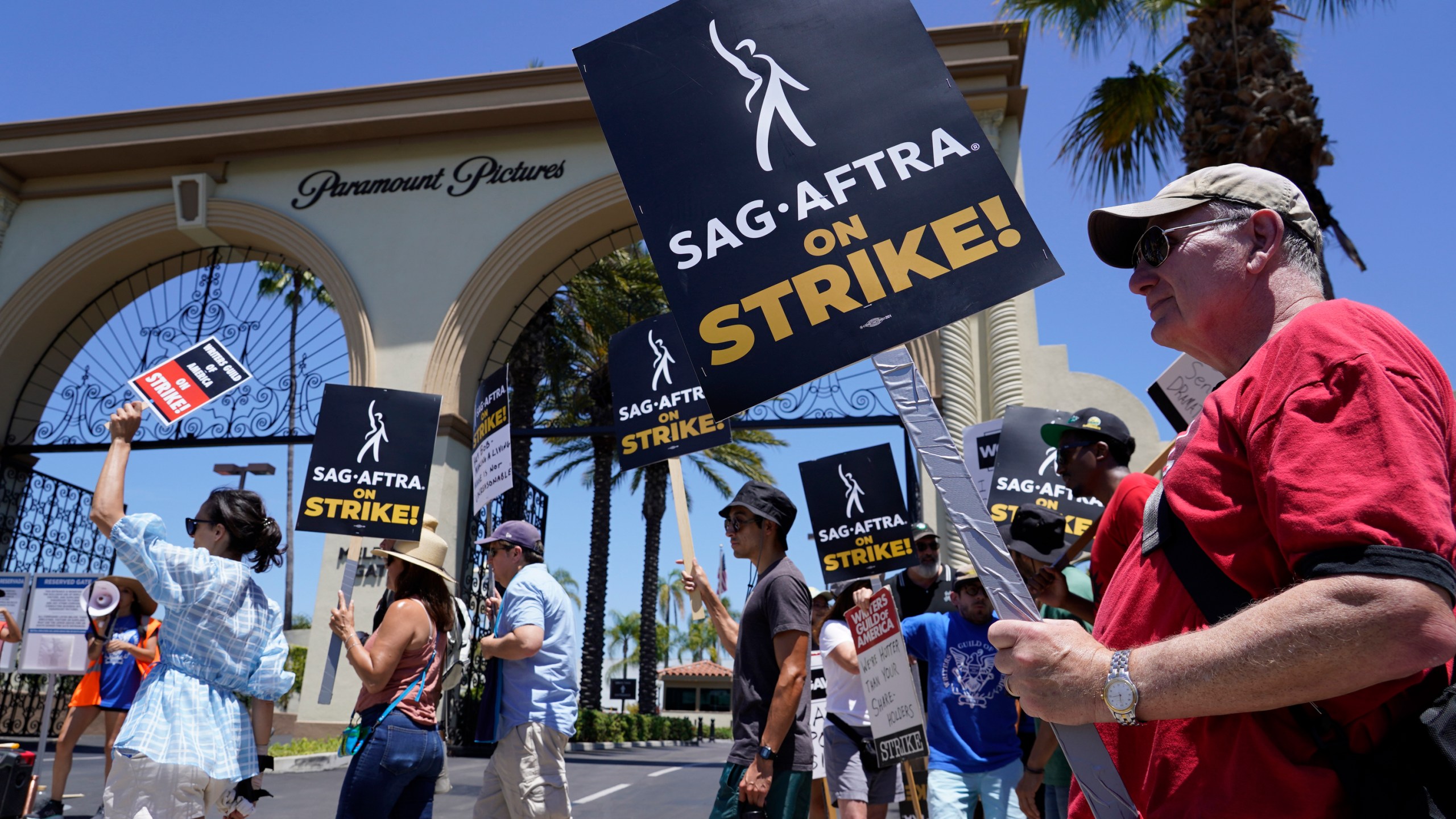 Striking writers and actors picket outside Paramount studios in Los Angeles on Friday, July 14, 2023. This marks the first day actors formally joined the picket lines, more than two months after screenwriters began striking in their bid to get better pay and working conditions. (AP Photo/Chris Pizzello)