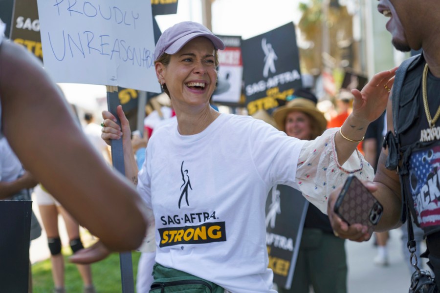 Actor Sarah Paulson joins a picket line outside Netflix studios on Tuesday, July 25, 2023, in Los Angeles. The actors strike comes more than two months after screenwriters began striking in their bid to get better pay and working conditions. (AP Photo/Mya Vinnett)