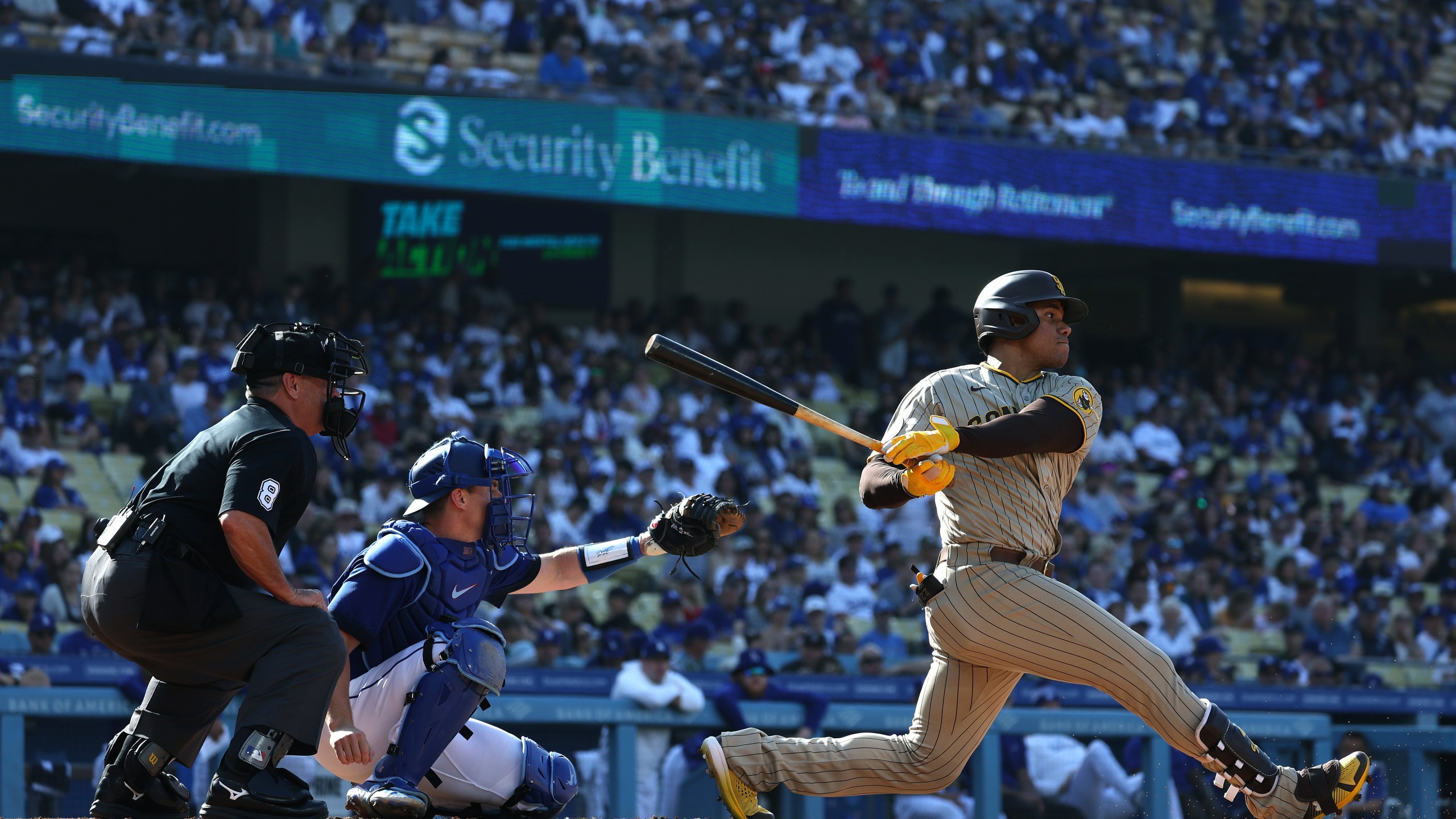 Juan Soto #22 of the San Diego Padres at bat in front of Will Smith #16 of the Los Angeles Dodgers during a 4-2 loss to the Los Angeles Dodgers at Dodger Stadium on May 13, 2023. (Harry How/Getty Images)