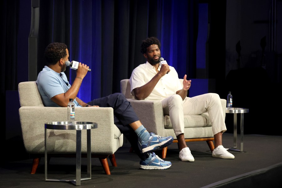 Maverick Carter and Joel Embiid on stage at the Uninterrupted Film Festival