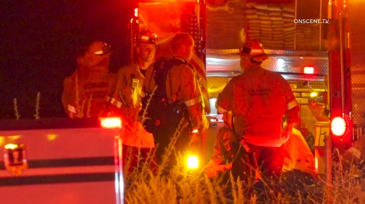 Firefighters work to extinguish the “Dry Fire,” as the flames continued spreading toward Castaic Lake on July 11, 2023. (OnScene.TV)