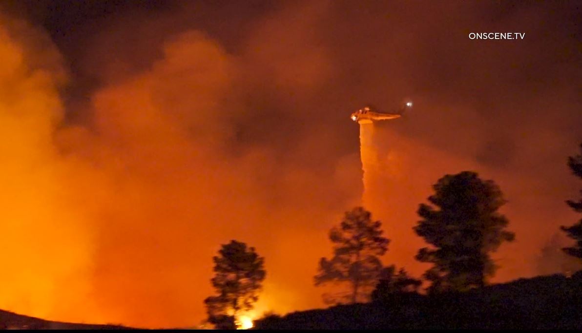 Firefighters work to extinguish the “Dry Fire,” as the flames continued spreading toward Castaic Lake on July 11, 2023.