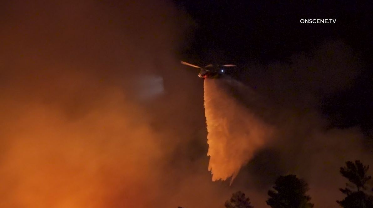 Firefighters work to extinguish the “Dry Fire,” as the flames continued spreading toward Castaic Lake on July 11, 2023. (OnScene.TV)