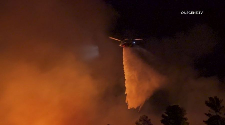 Firefighters work to extinguish the “Dry Fire,” as the flames continued spreading toward Castaic Lake on July 11, 2023. (OnScene.TV)