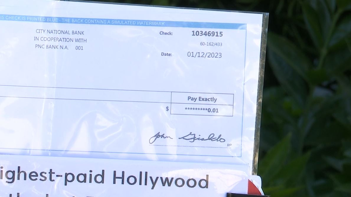 Actor Anthony Abate showed an example of a residual check he received which amounted to one penny. (KTLA)