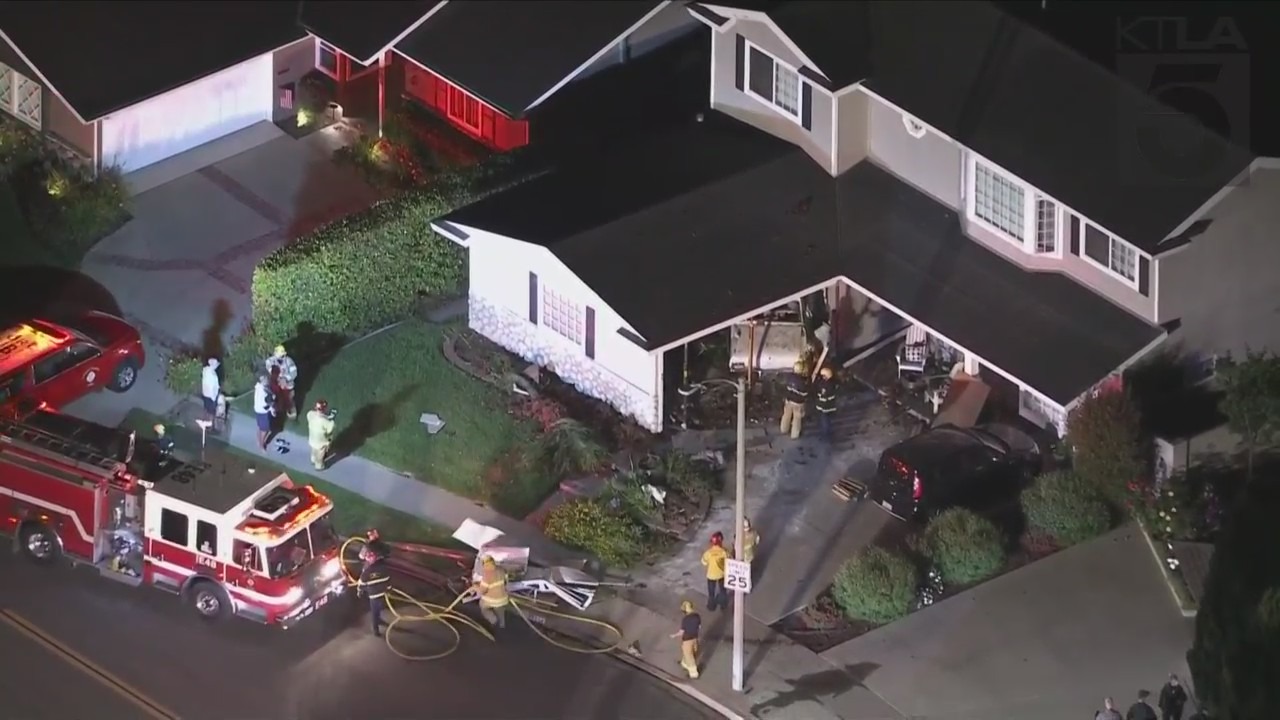 One person was hospitalized after a vehicle slammed into a Seal Beach home on July 7, 2023. (KTLA)