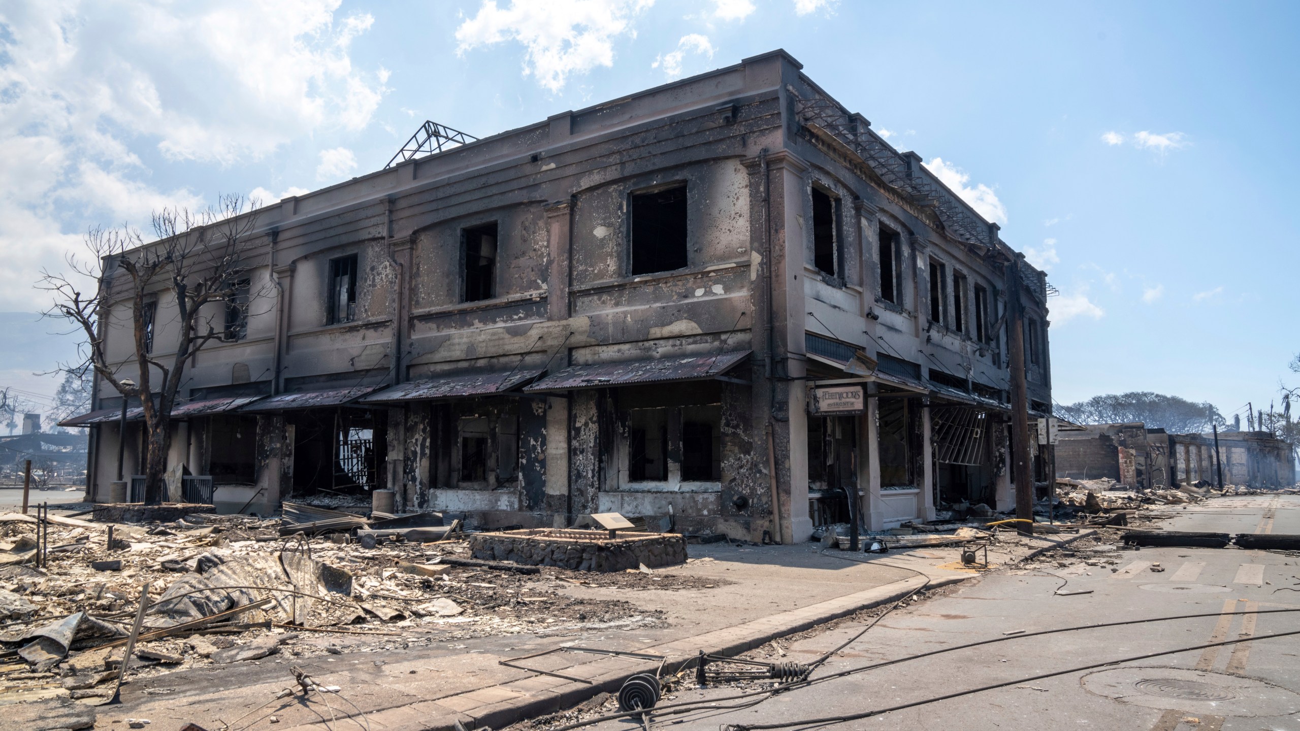 Wildfire wreckage is seen Wednesday, Aug. 9, 2023, in Lahaina, Hawaii. The scene at one of Maui's tourist hubs on Thursday looked like a wasteland, with homes and entire blocks reduced to ashes as firefighters as firefighters battled the deadliest blaze in the U.S. in recent years. (Tiffany Kidder Winn via AP)