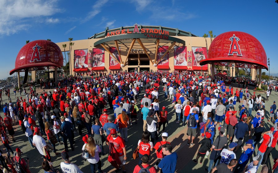 Fans line up outside Angel Stadium of Anaheim for an opening day baseball game between the Los Angeles Angels and the Chicago Cubs in Anaheim, Calif., on April 4, 2016. Harish Singh Sidhu, the former mayor of the Southern California city of Anaheim has agreed to plead guilty to obstructing an FBI corruption investigation into the $150 million sale of Angel Stadium to the owner of the Major League Baseball team, federal prosecutors announced Wednesday, Aug. 16, 2023. (AP Photo/Mark J. Terrill, File)