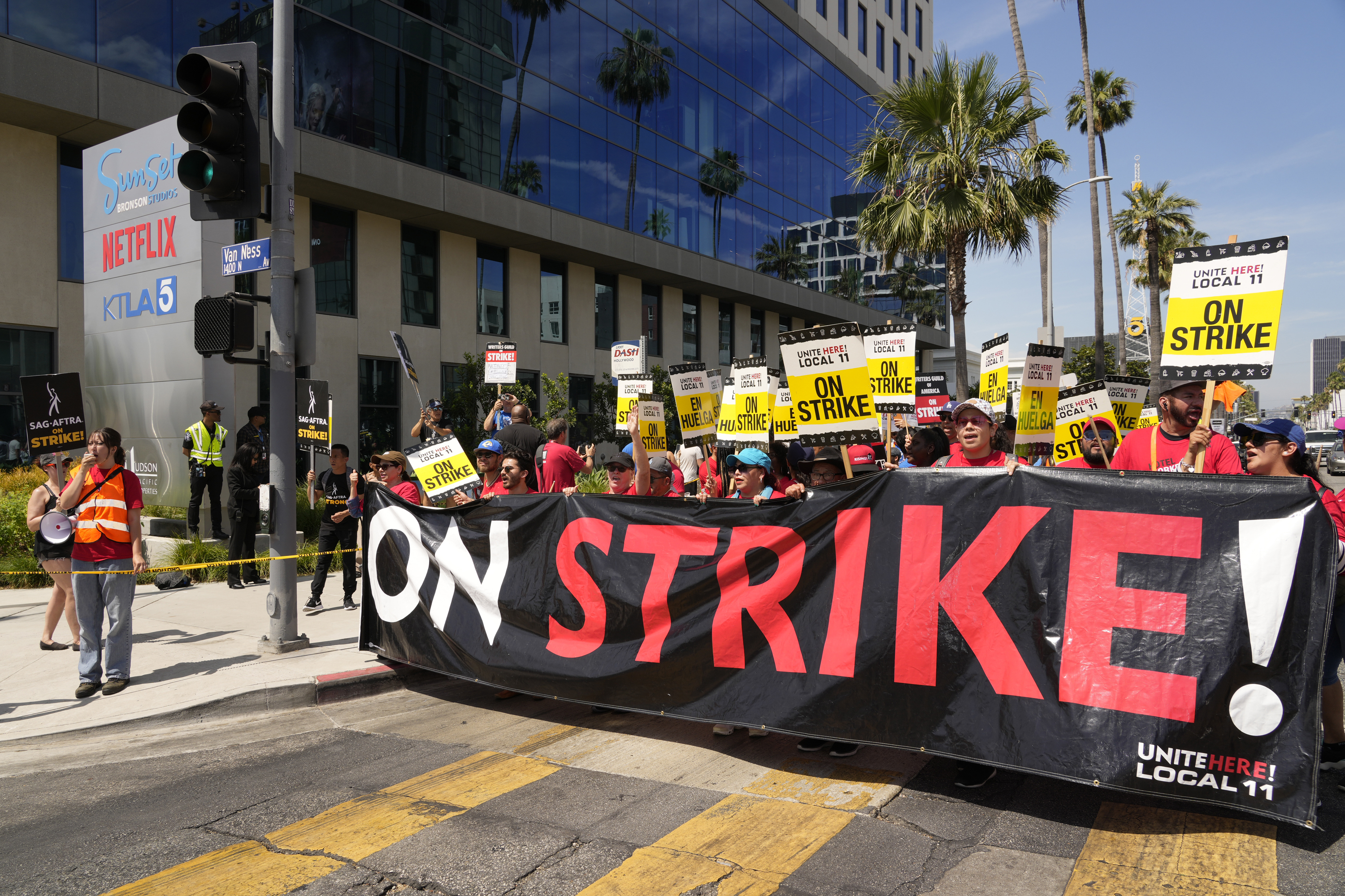 Striking Hotel workers from Unite Here Local 11 join the picketing actors of SAG-AFTRA, and writers of the WGA, outside Netflix studios on July 21, 2023, in Los Angeles. (AP Photo/Chris Pizzello, File)