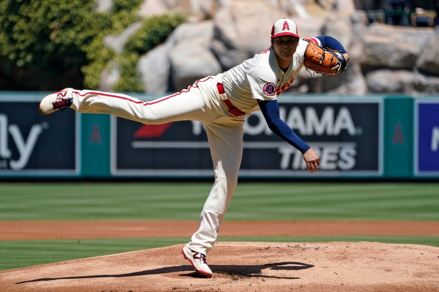 Los Angeles Angels starting pitcher Shohei Ohtani throws to the plate during the first inning of a baseball game against the Cincinnati Reds Wednesday, Aug. 23, 2023, in Anaheim, Calif. (AP Photo/Mark J. Terrill)