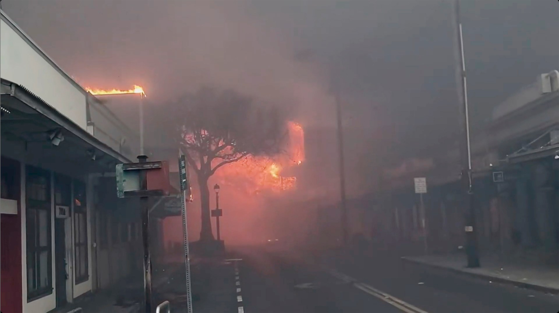 AUG. 8 - Smoke and flames fill the air from raging wildfires on Front Street in downtown Lahaina, Maui on Tuesday, Aug. 8, 2023. (Alan Dickar via AP)