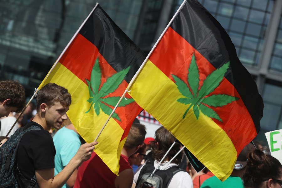 Activists, including two waving German flags that have a marijuana leaf painted on them, demanding the legalization of marijuana prepare to march in the annual Hemp Parade (Hanfparade) on Aug. 13, 2016, in Berlin, Germany. (Sean Gallup/Getty Images)