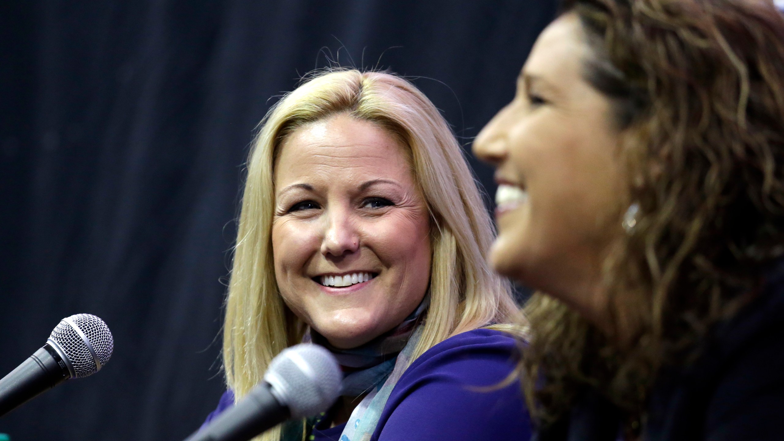 Washington Athletic Director Jennifer Cohen, left, looks on as new Washington women's basketball head coach Jody Wynn speaks at the end of a news conference introducing her Monday, April 17, 2017, in Seattle. (AP Photo/Elaine Thompson)