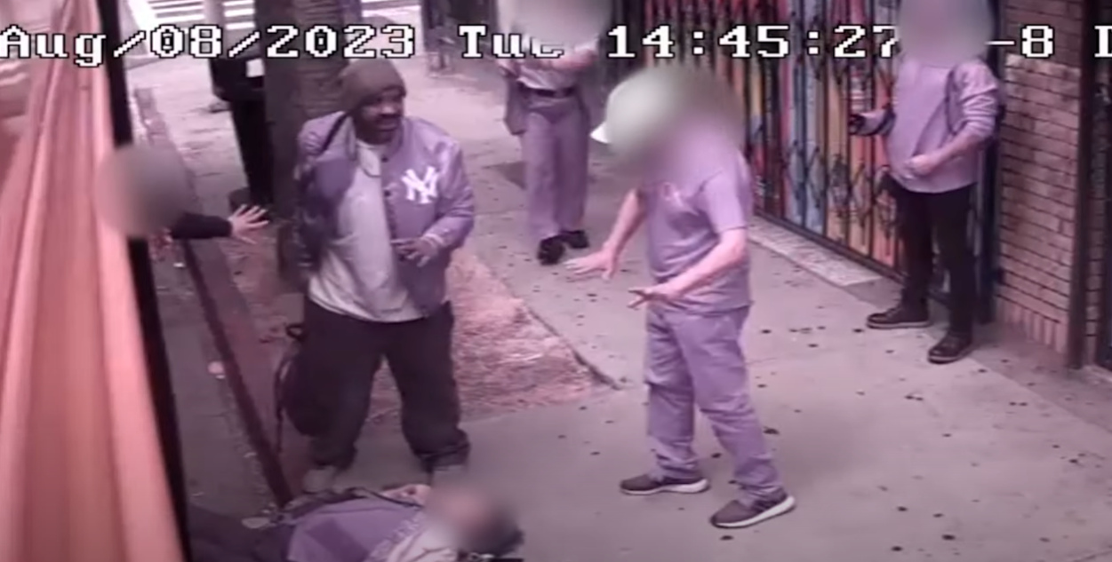 The LAPD released footage of a man accused of taking an injured woman's wallet on Aug. 8, 2023.