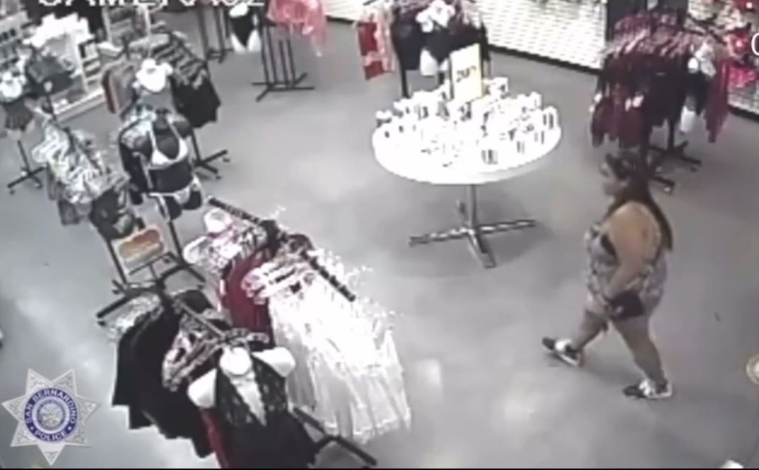 Security video captured two suspects walking into a store, assaulting employees and stealing merchandise in San Bernardino. (San Bernardino Police Department)