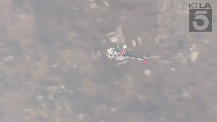 Fire crews battling the massive Rock Fire in Perris on August 9, 2023. (KTLA)