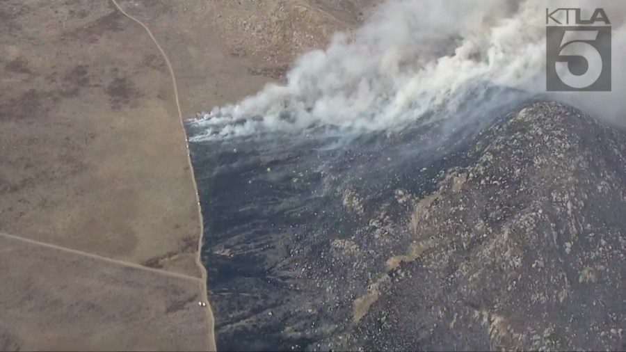 Fire crews battling the massive Rock Fire in Perris on August 9, 2023. (KTLA)