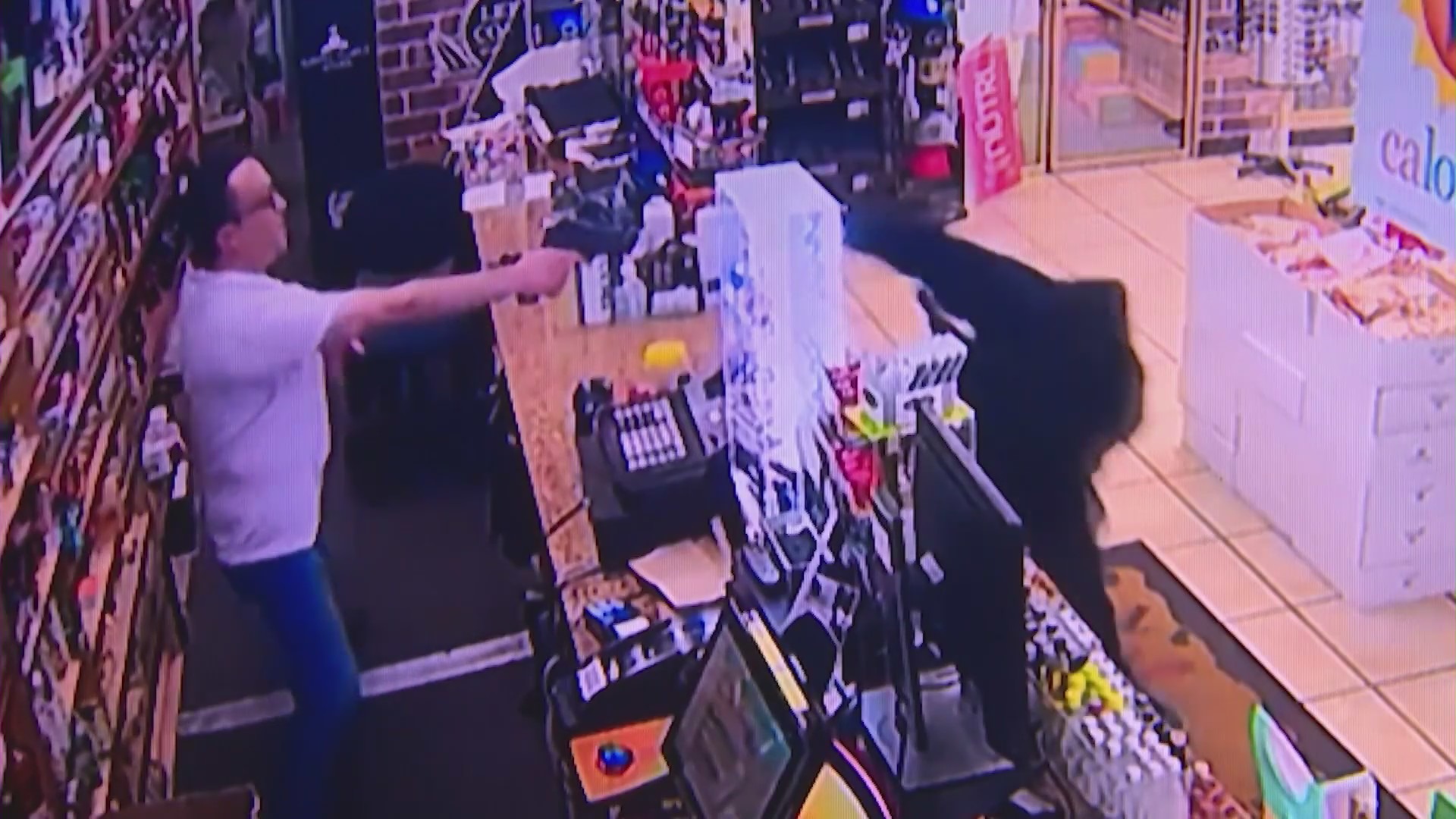 Security cameras captured the moment a store clerk thwarted an attempted armed robbery in Fountain Valley on August 16, 2023. (Cousins Liquor & Deli)