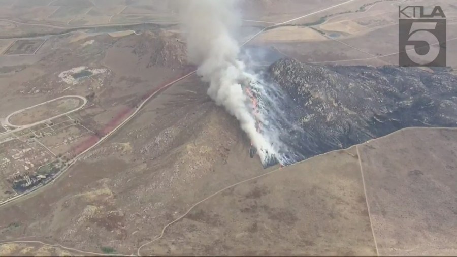 Fire crews battling the massive Rock Fire in Perris on August 9, 2023. (KTLA)