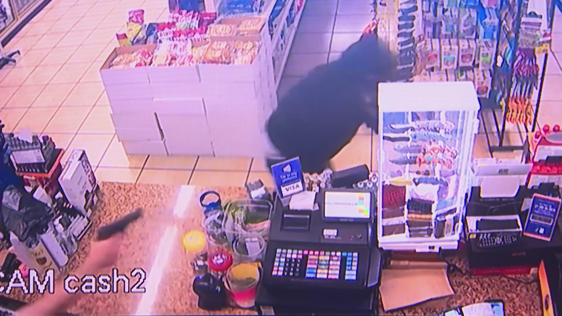 Security cameras captured the moment a store clerk thwarted an attempted armed robbery in Fountain Valley on August 16, 2023. (Cousins Liquor & Deli)